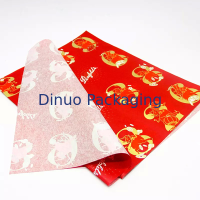 Envoltura de regalo de Navidad que empaqueta el papel de seda rojo con la impresión floral de la hoja de oro