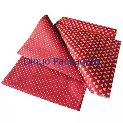 Envoltura de regalo de Navidad que empaqueta el papel de seda rojo con la impresión floral de la hoja de oro