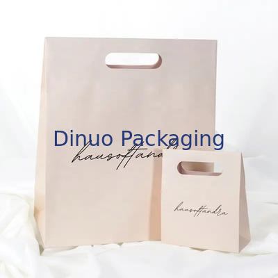 Embalaje de ropa Manija de corte a presión Bolsas de papel Kraft personalizadas Bolsas de regalo amarillas