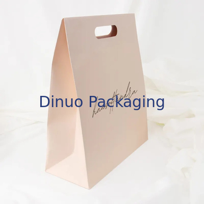 Embalaje de ropa Manija de corte a presión Bolsas de papel Kraft personalizadas Bolsas de regalo amarillas
