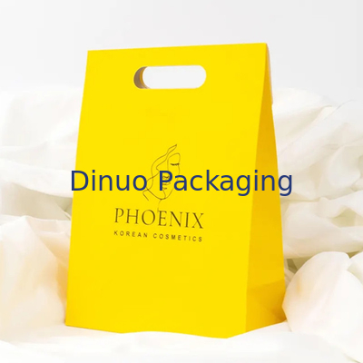 Embalaje de ropa Manija de corte a presión Bolsas de papel Kraft personalizadas Bolsas de regalo amarillas
